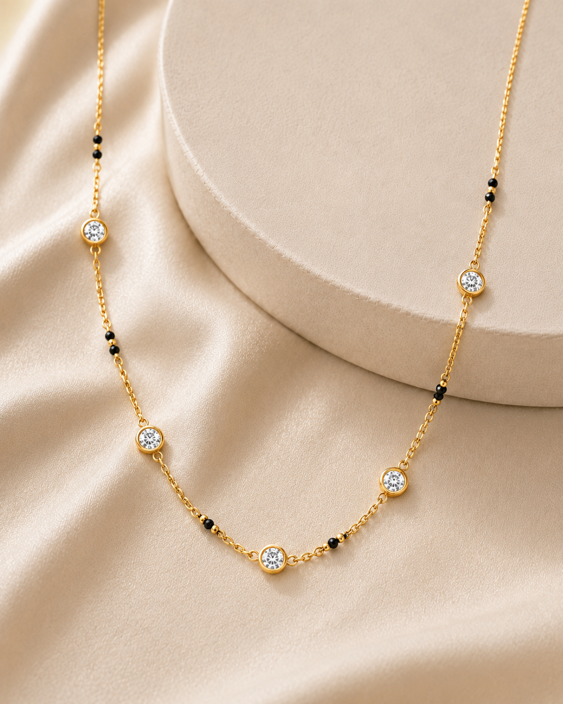 14K gold graduated diamond station necklace by Oré