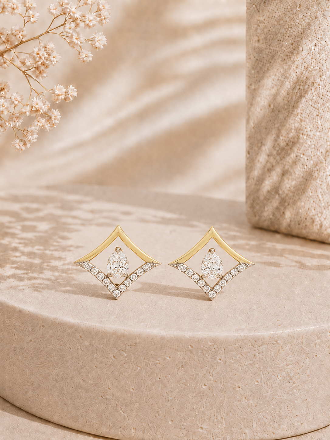 18K gold kite frame diamond earrings by Oré