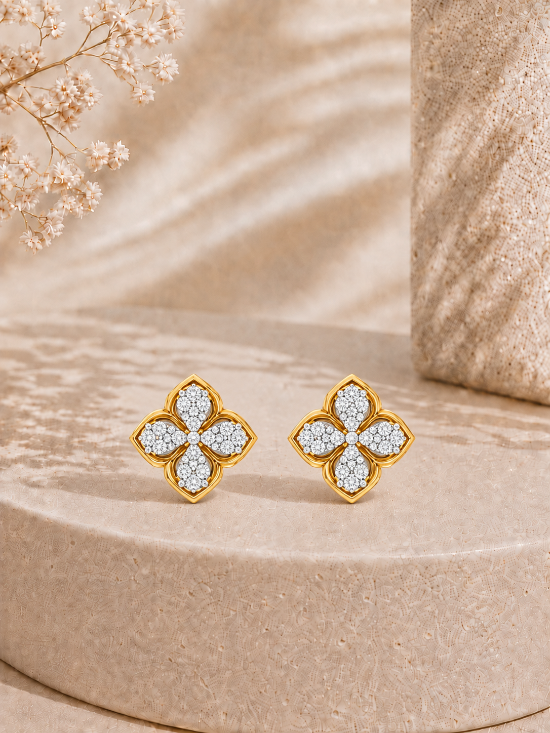 14K gold four-petal floral diamond earrings by Oré