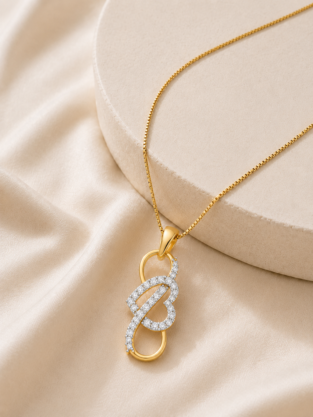 9K gold infinity knot diamond pendant by Oré