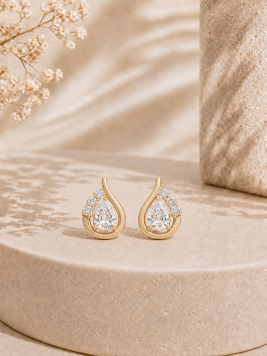 18K gold pear swirl diamond earrings by Oré, view 3