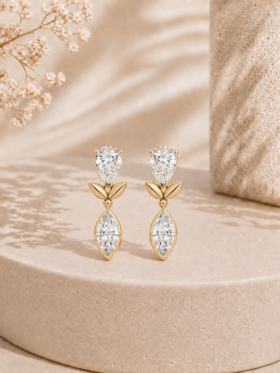 18K gold bow pear drop diamond earrings by Oré