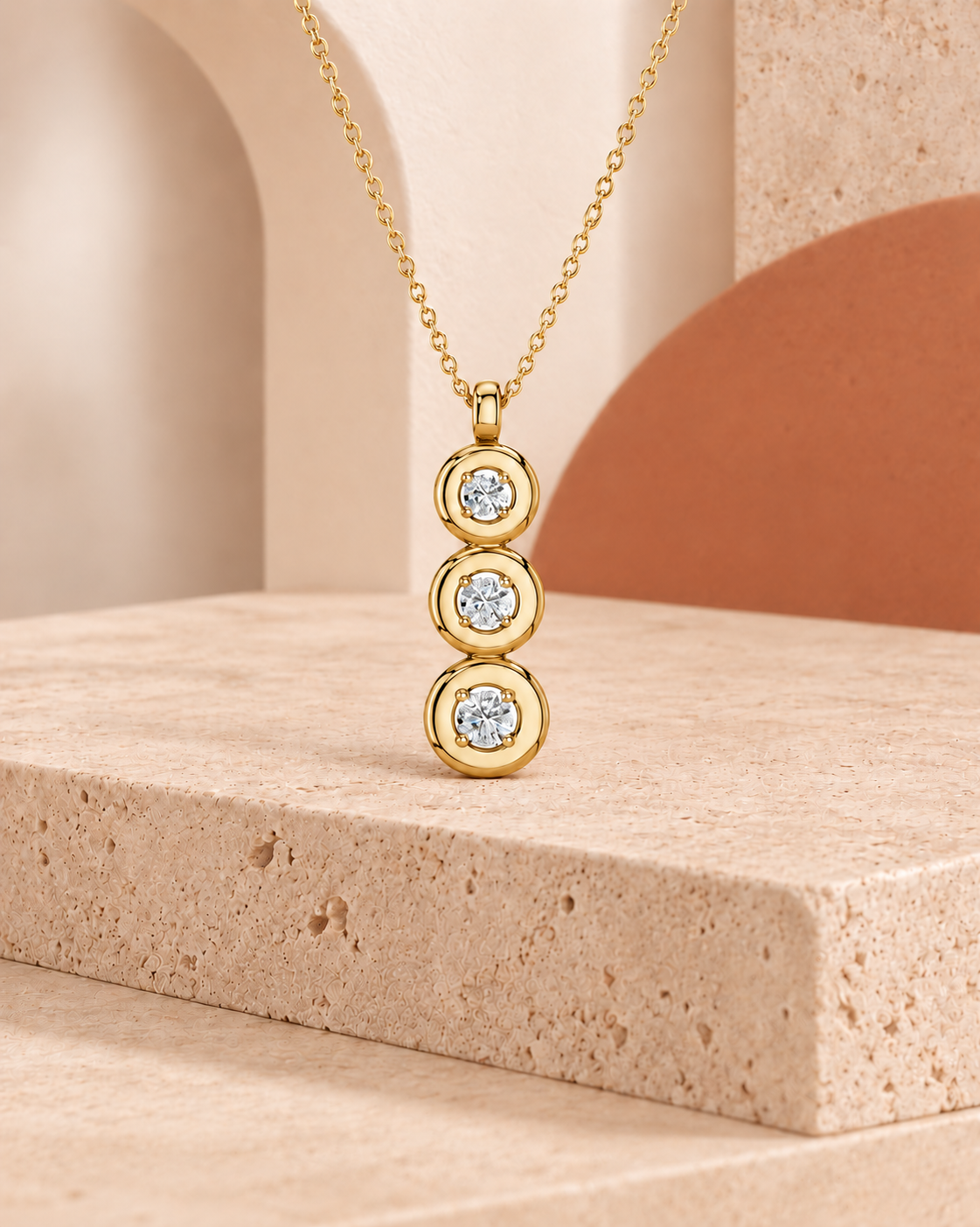 9K yellow gold graduated round drop diamond pendant by Oré