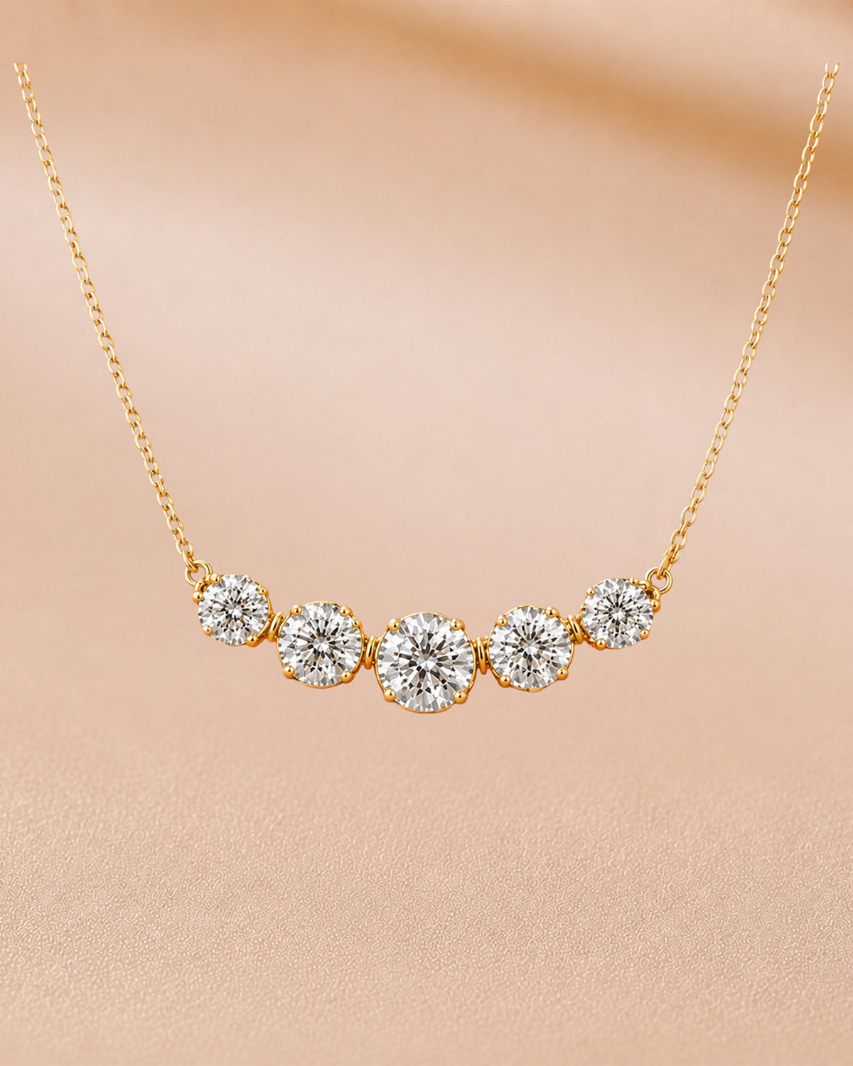 9K rose gold five-stone graduated diamond necklace by Oré