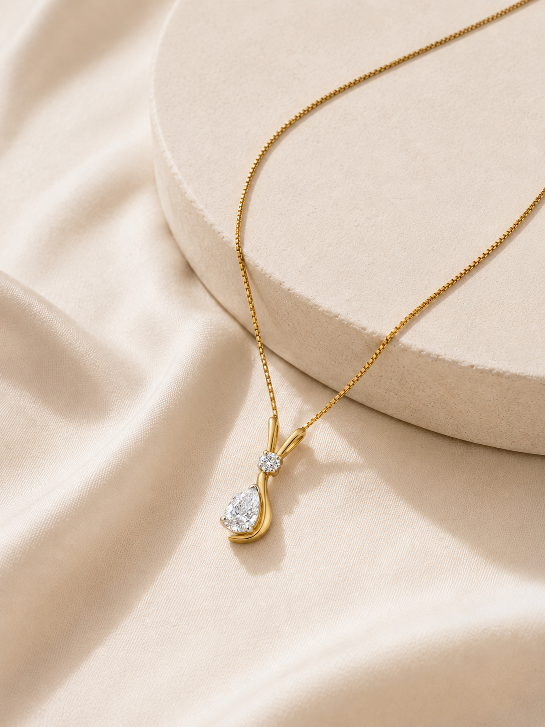 9K gold pear drop diamond pendant by Oré