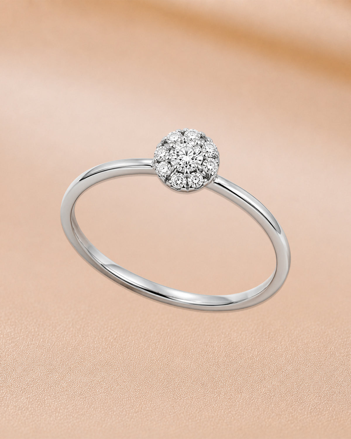 14K rose gold circular solitaire diamond ring by Oré