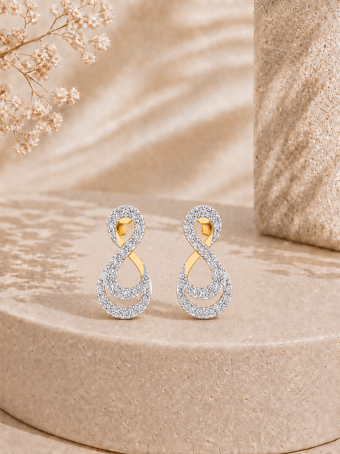 9K gold infinity twist diamond earrings by Oré